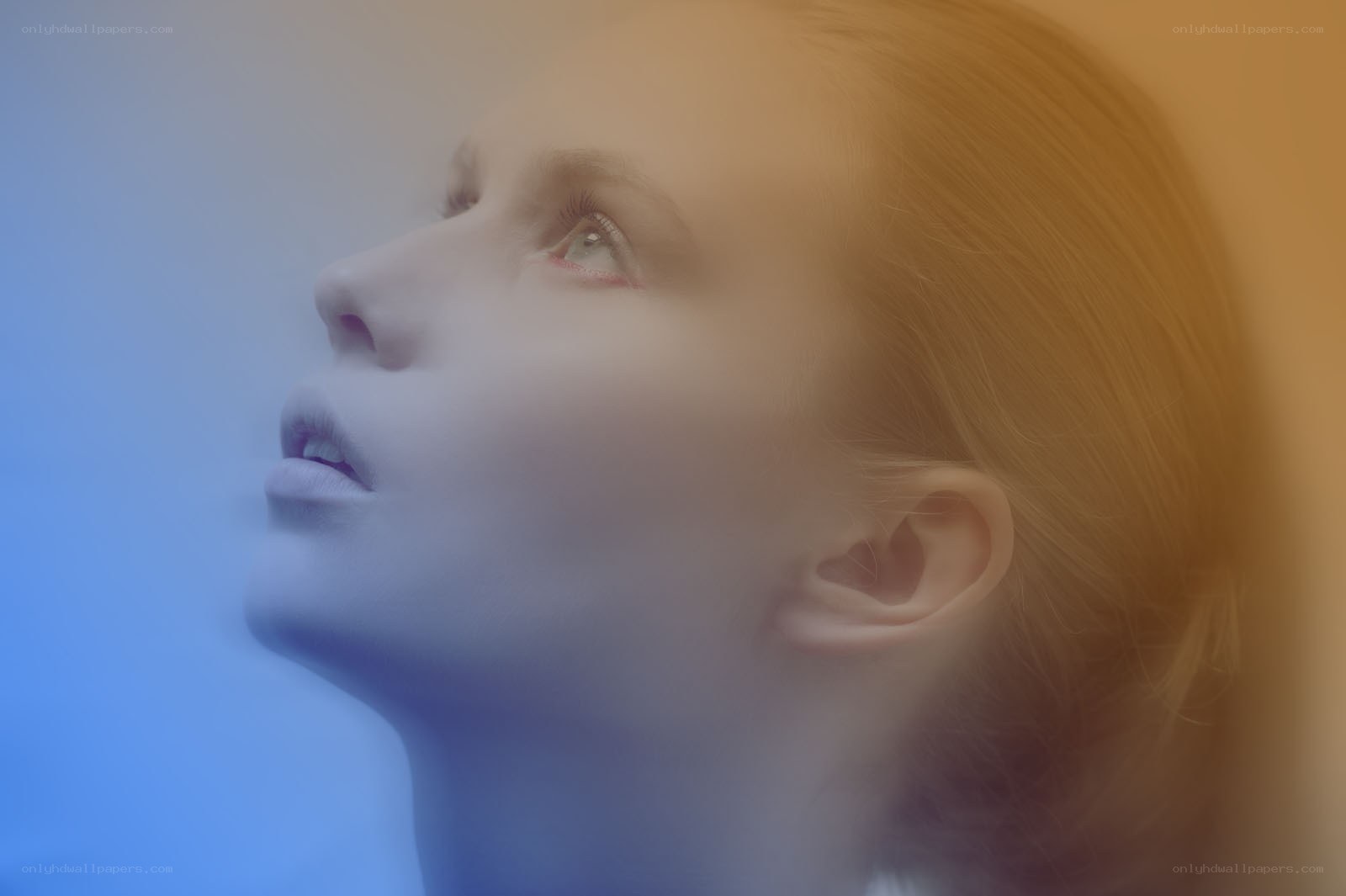 woman looking up in light