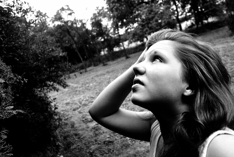 woman looking up in nature