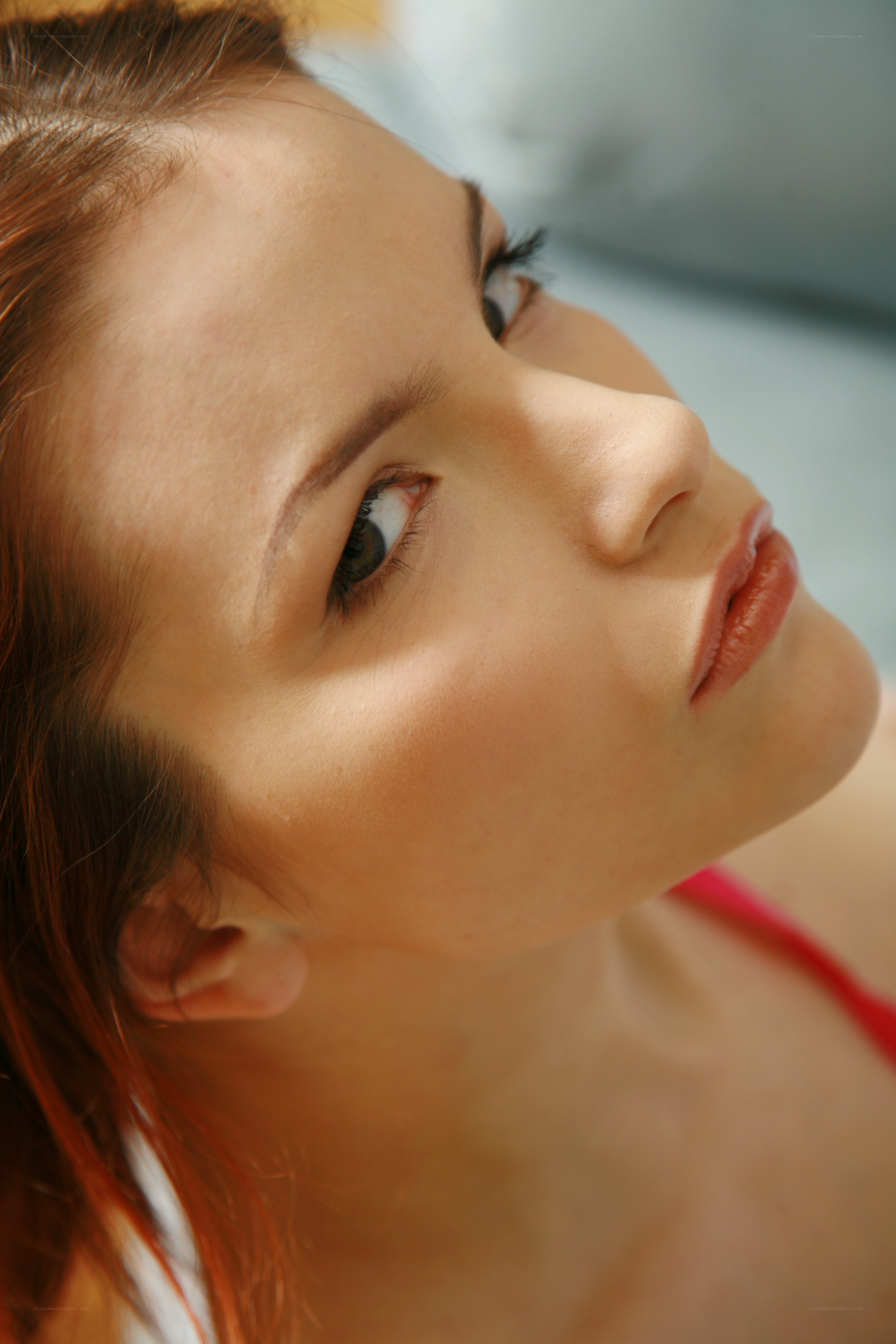 woman looking up in sunlight