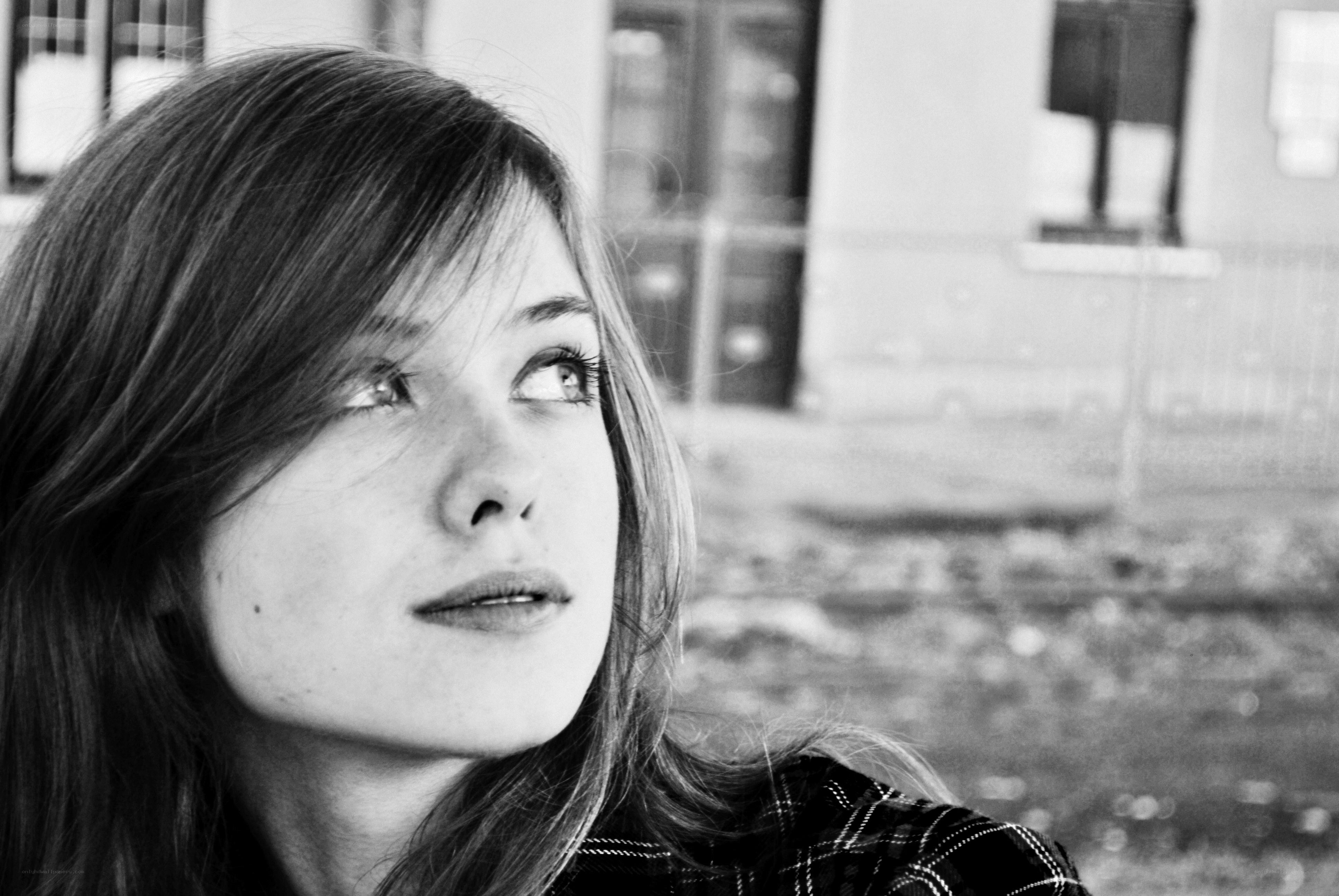 woman looking up thoughtfully
