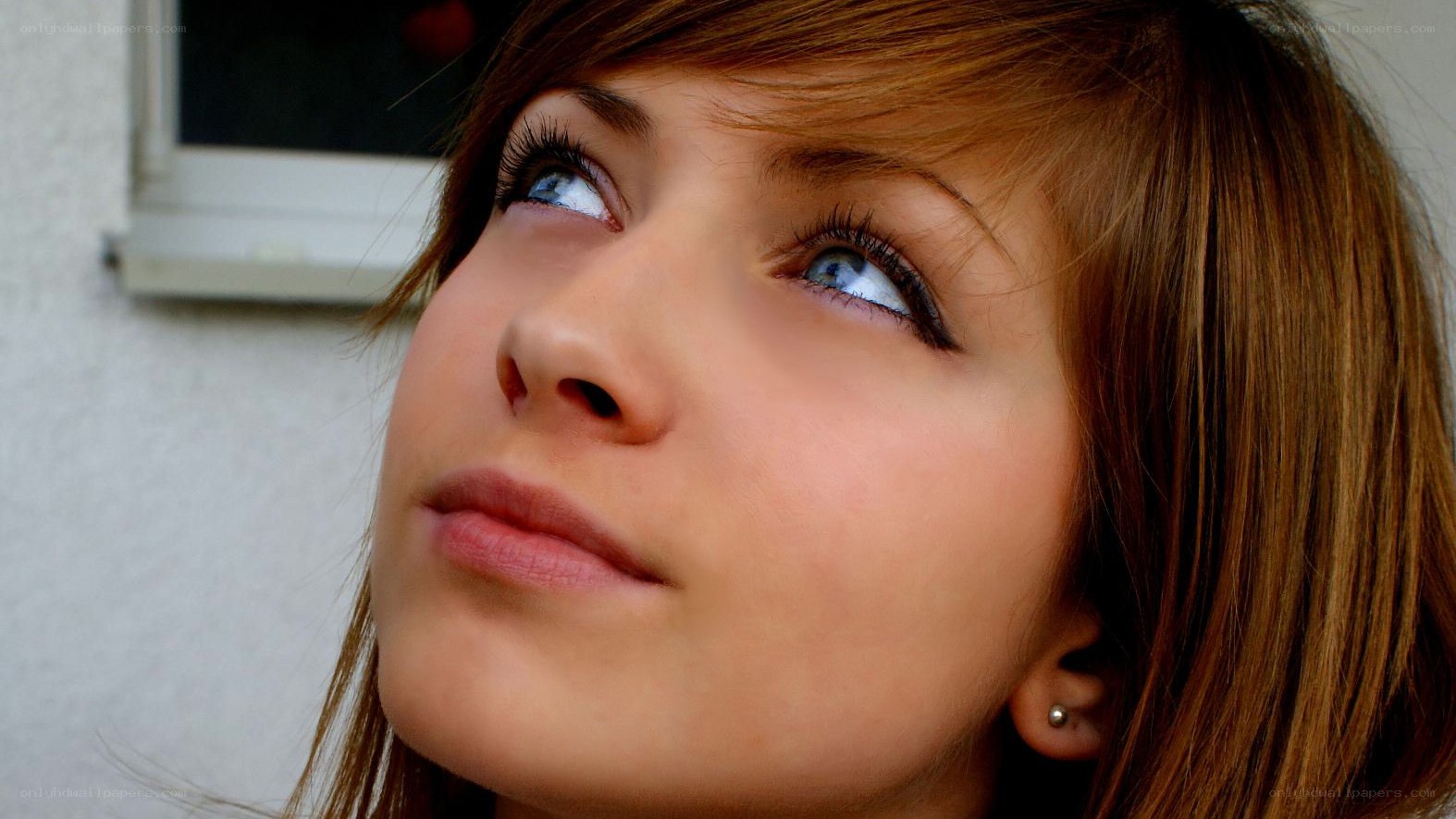 woman looking up thoughtfully
