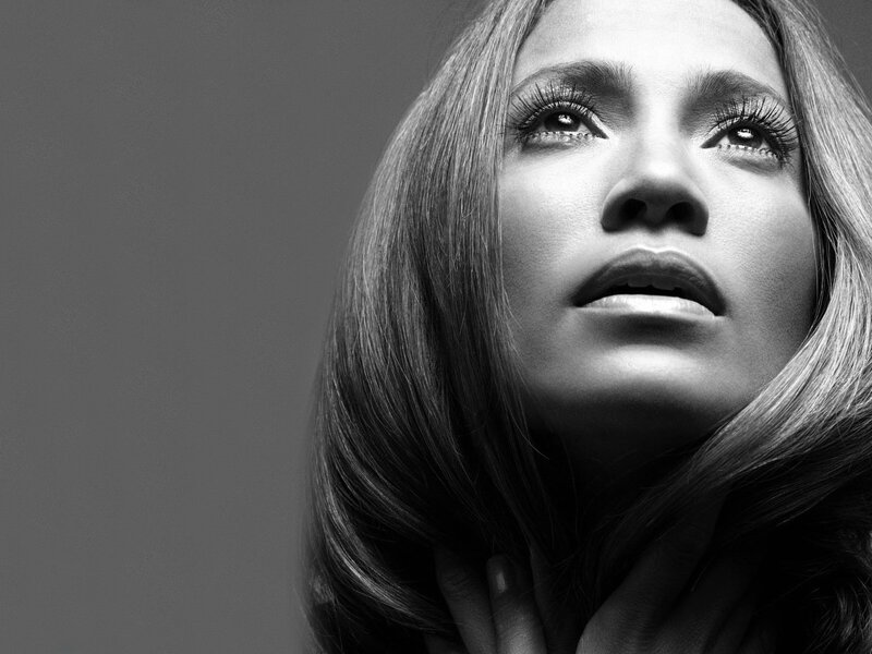woman looking upward in black and white