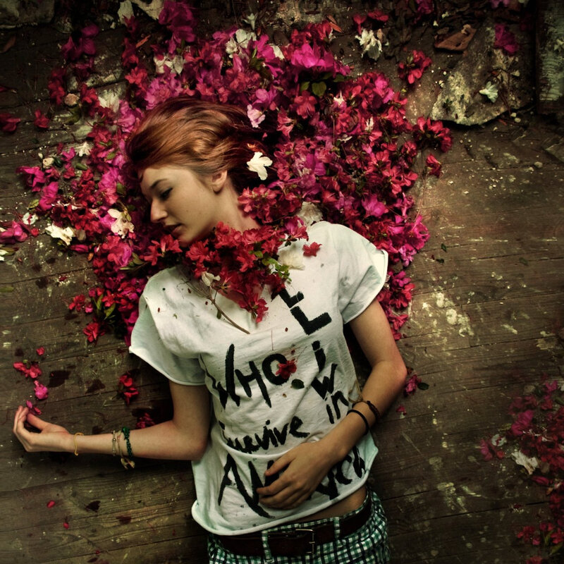 woman lying among flowers