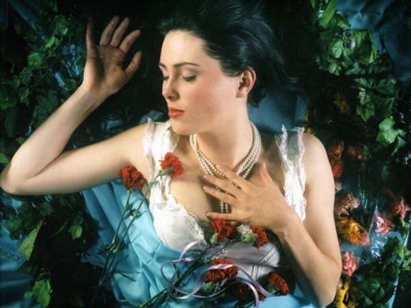 woman lying among flowers