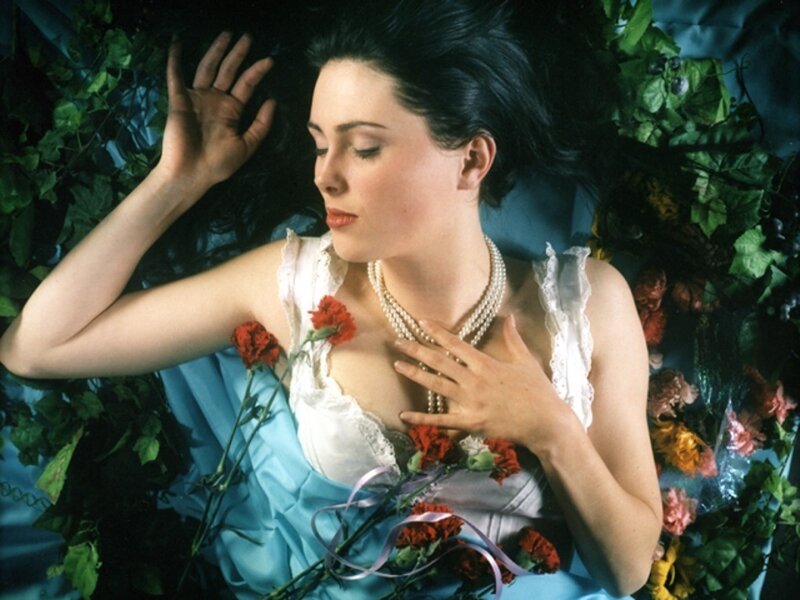 woman lying among flowers