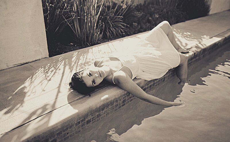 Woman Lying by Pool — Black, Serene