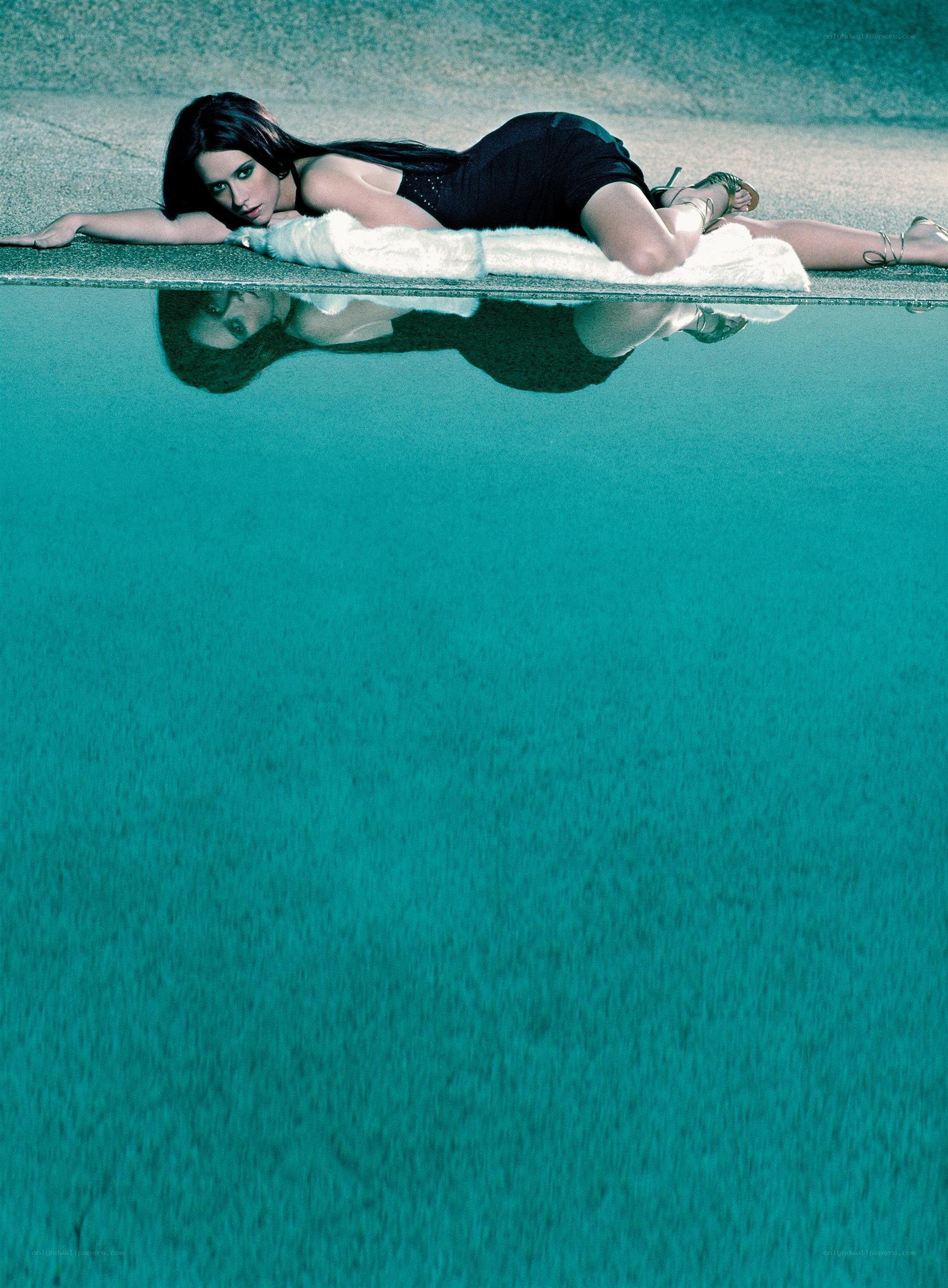 woman lying by poolside