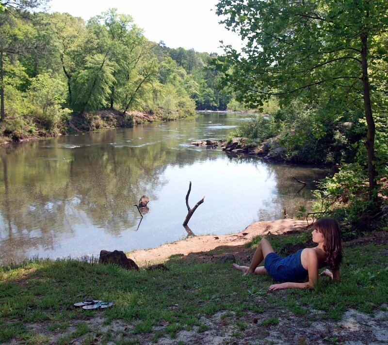 Woman Lying by River