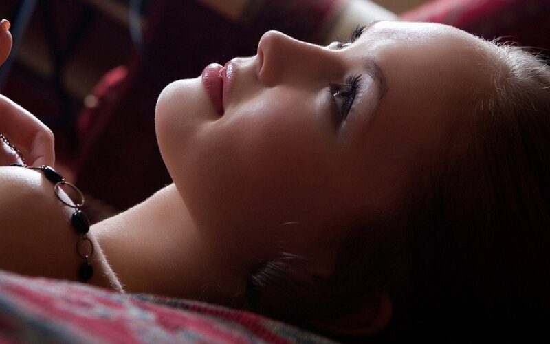 Woman Lying Down — Brown, Calm, Photograph, Necklace, Red Fabric
