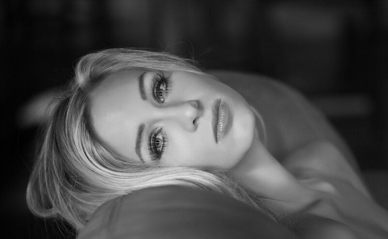 woman lying down in black and white