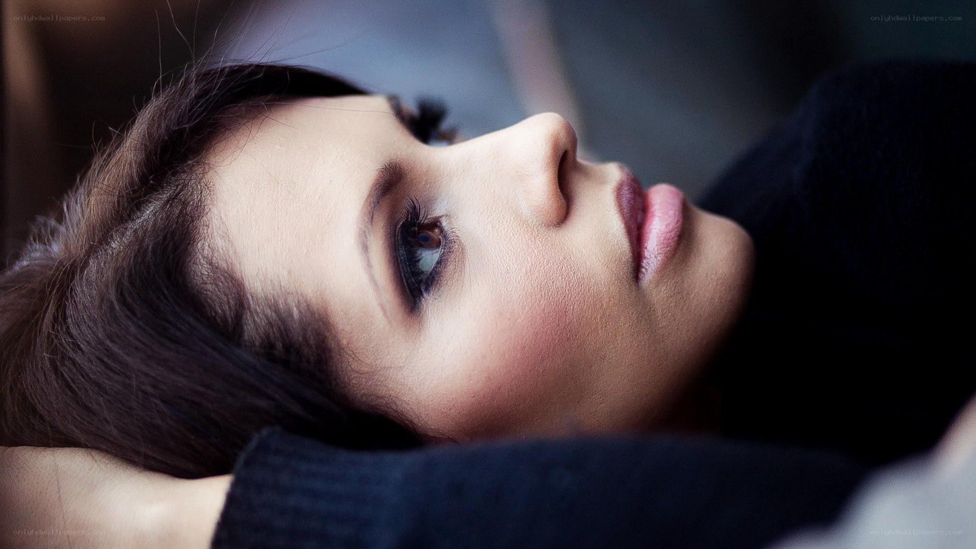 woman lying down in profile