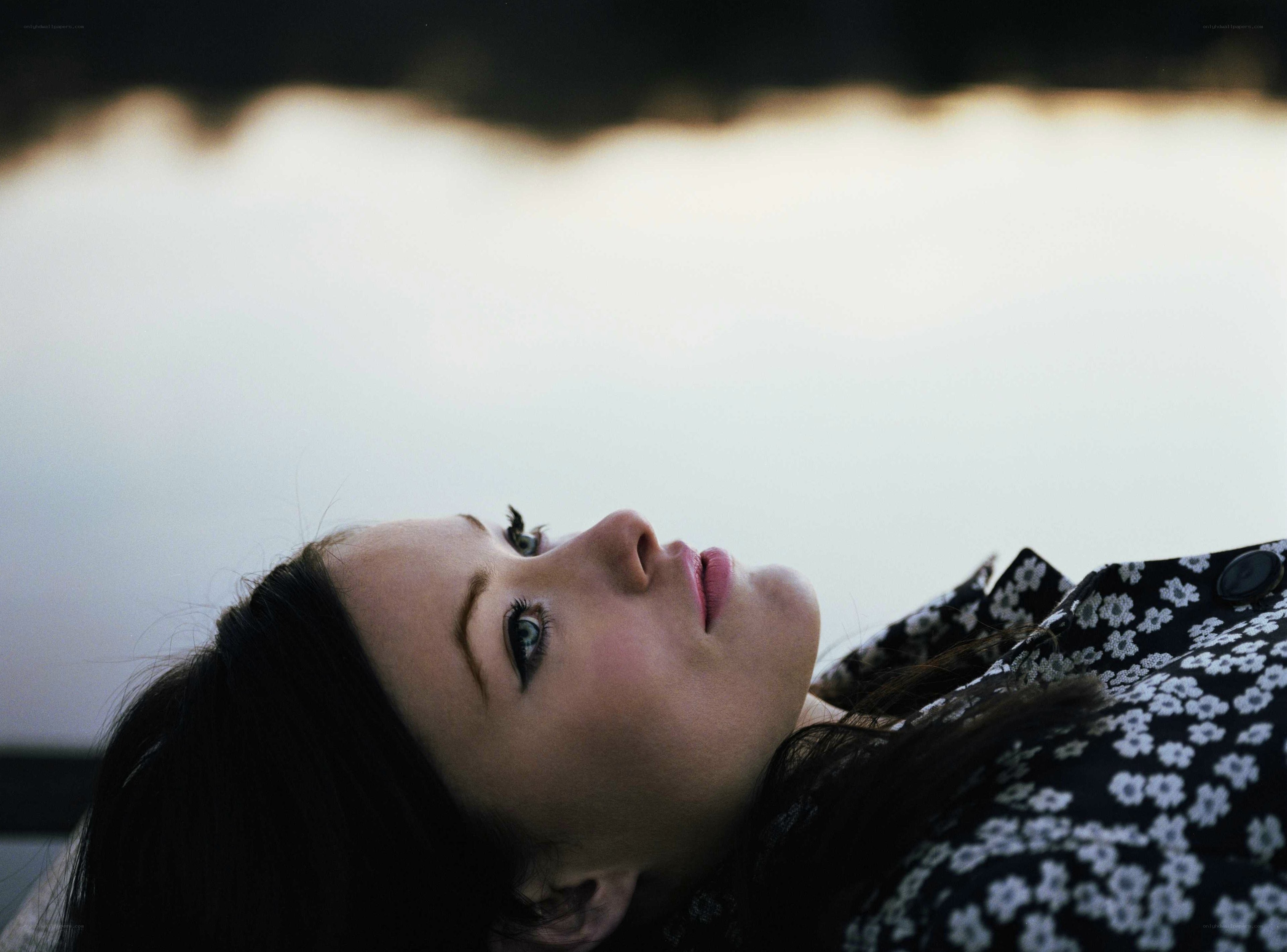 woman lying down looking up