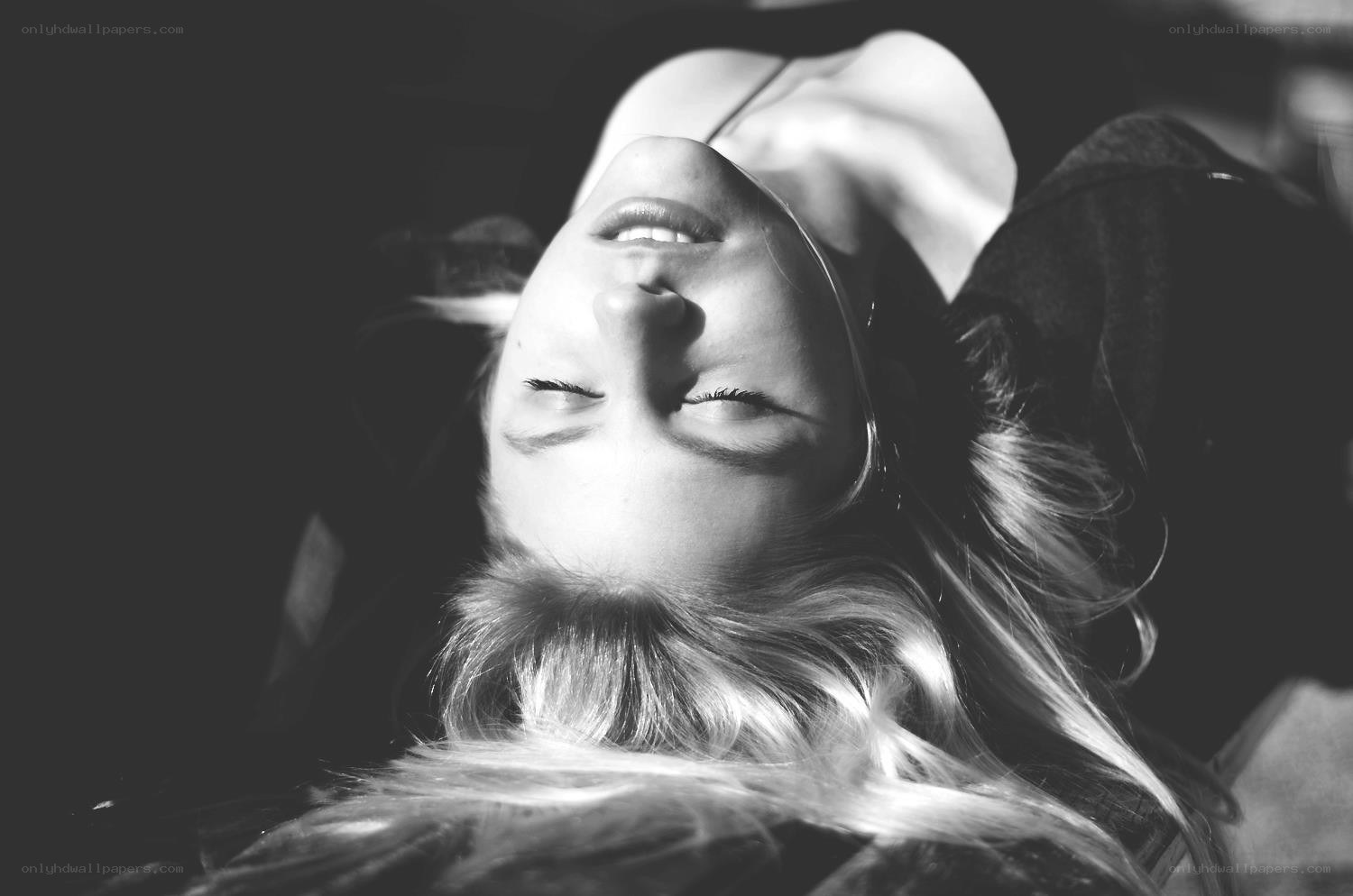 woman lying down with eyes closed