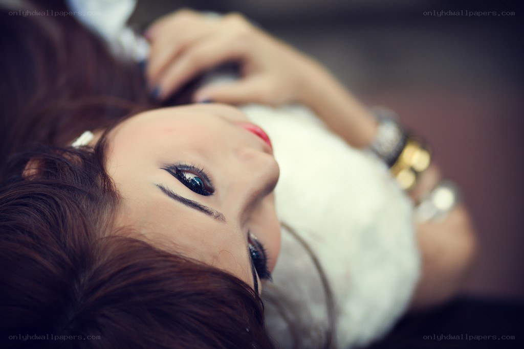woman lying down with makeup