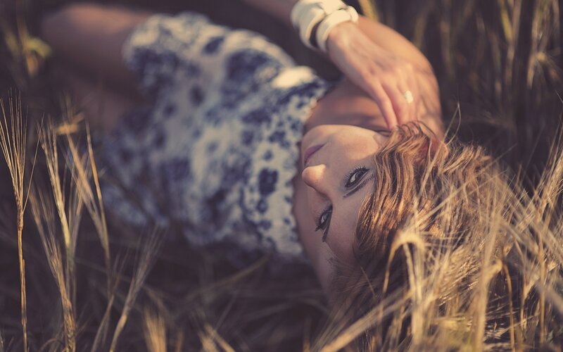 woman lying in a field