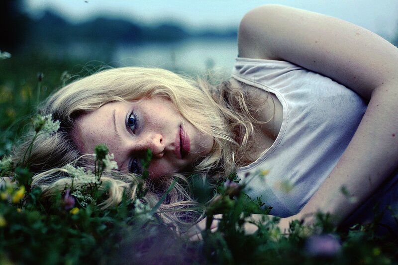 woman lying in a field
