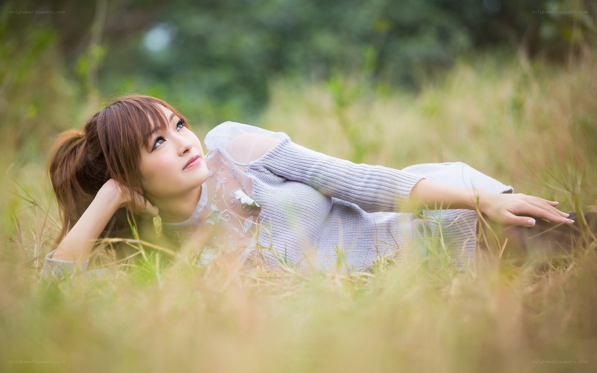 woman lying in a field