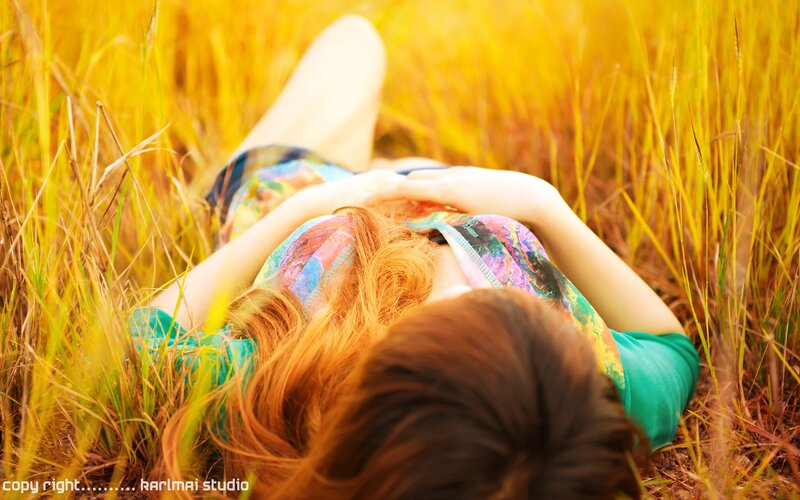 woman lying in a field
