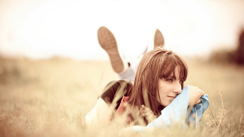 woman lying in a field
