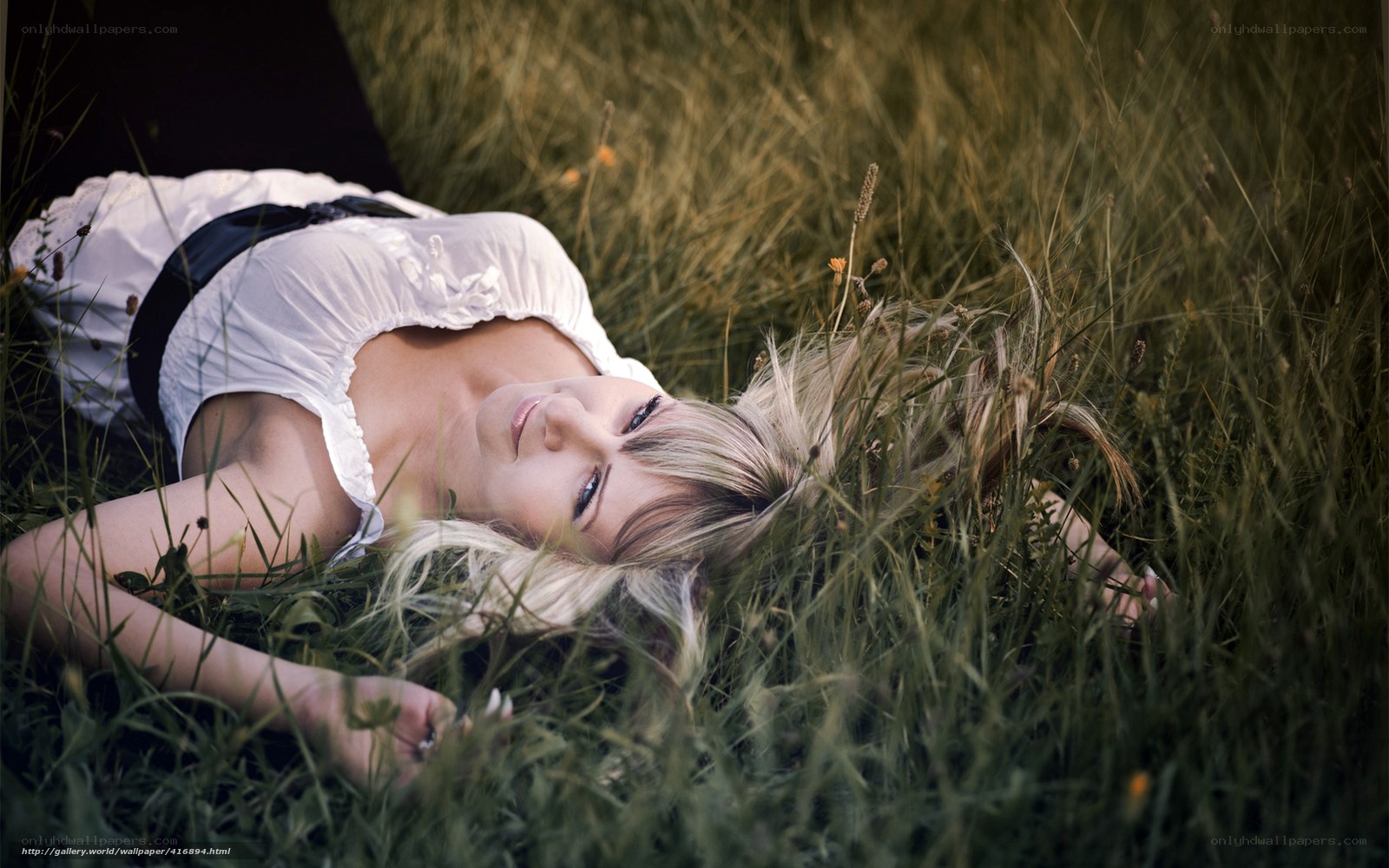 Woman lying in a field