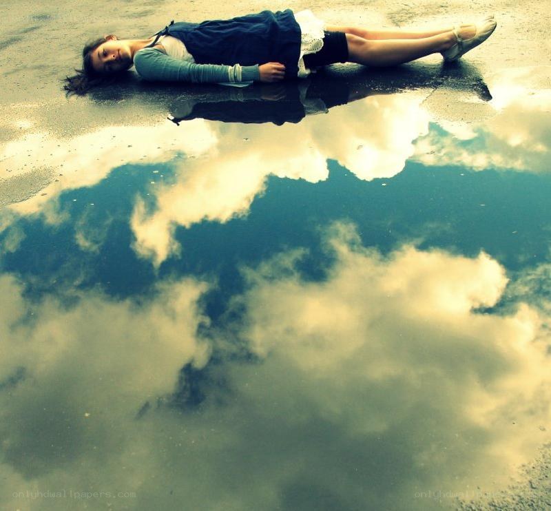 Woman lying in a puddle
