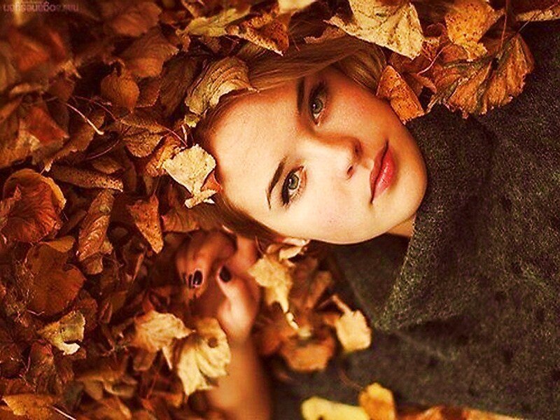Woman Lying in Autumn Leaves — Brown