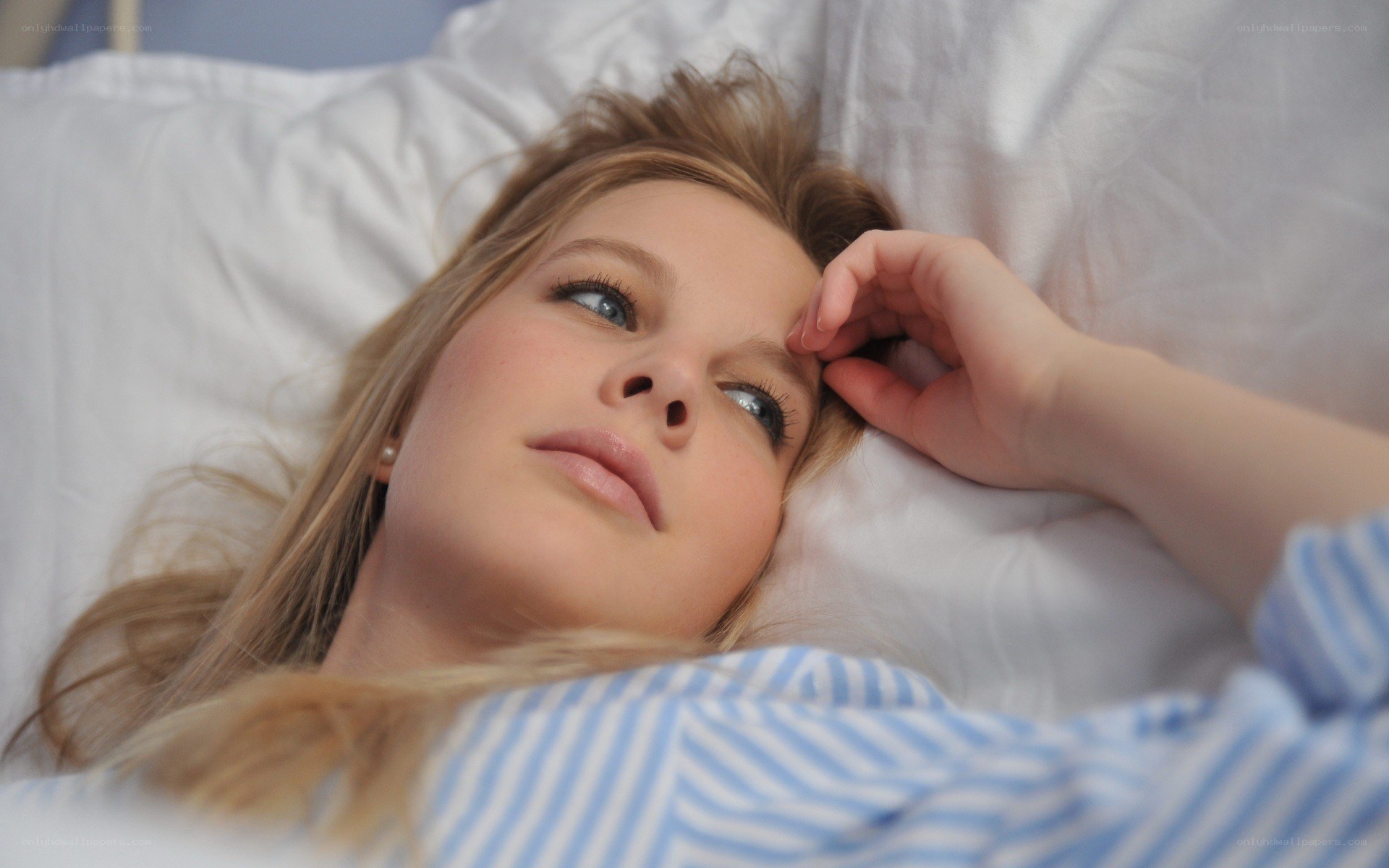 woman lying in bed awake