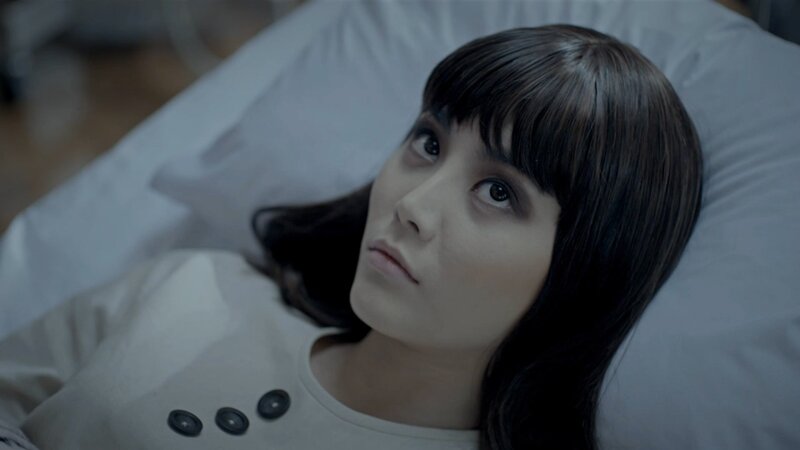 woman lying in bed looking up