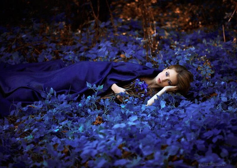 Woman Lying in Blue Leaves — Serene