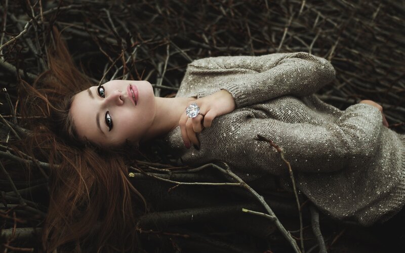 Woman lying in branches
