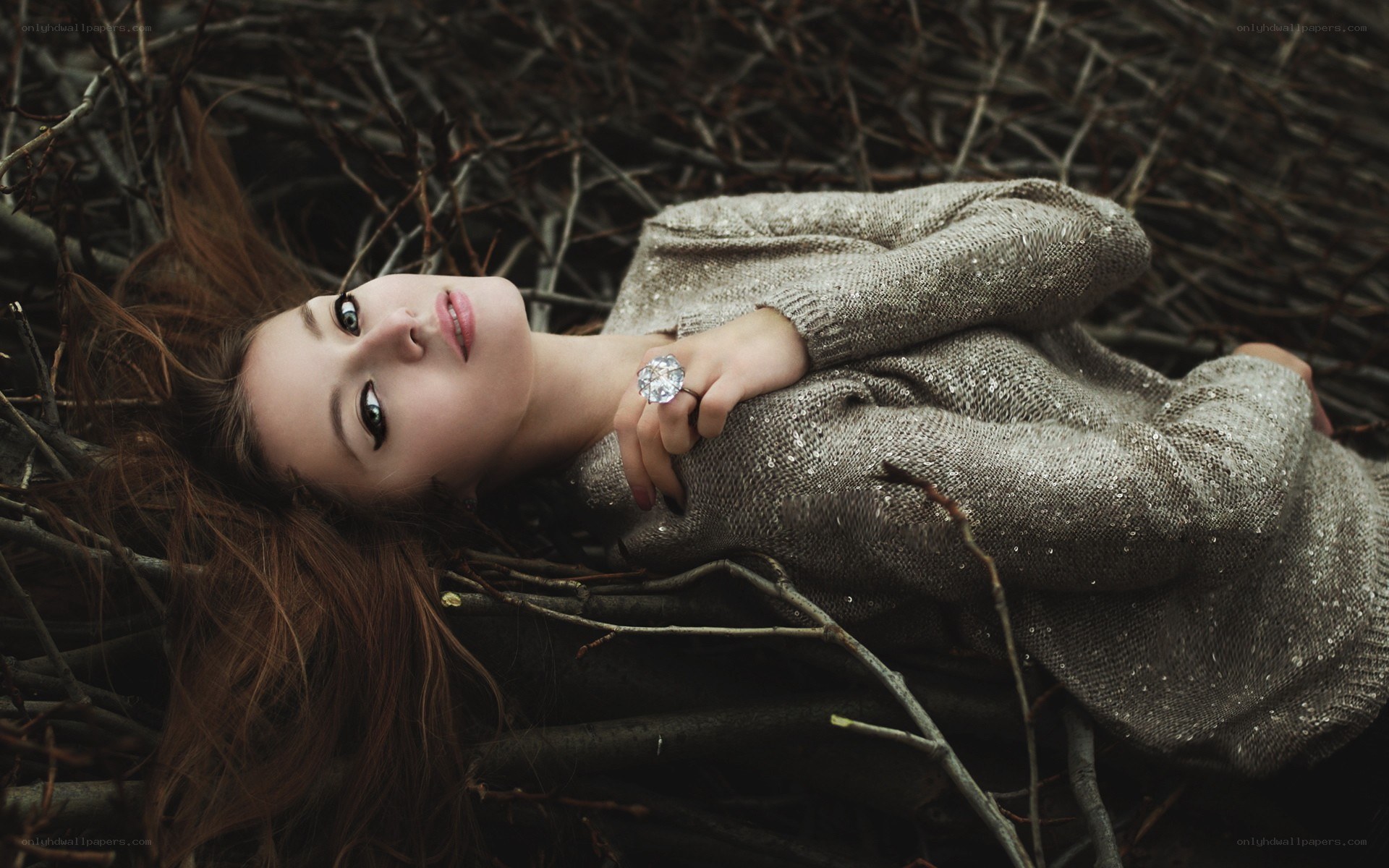 Woman lying in branches
