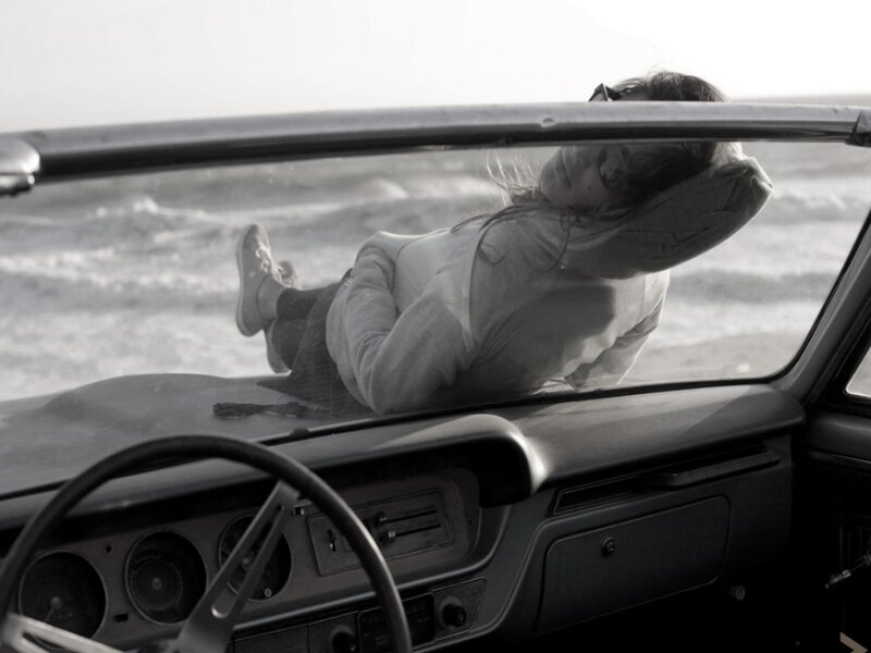 Woman Lying in Car — Black