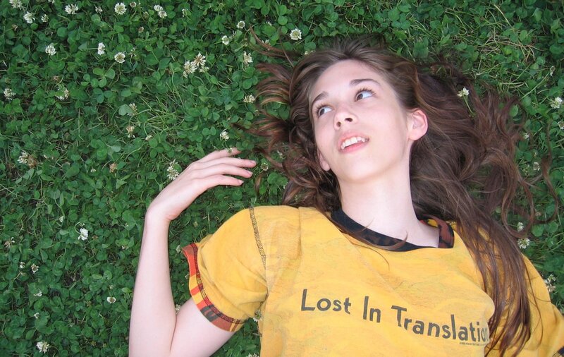 woman lying in clover field