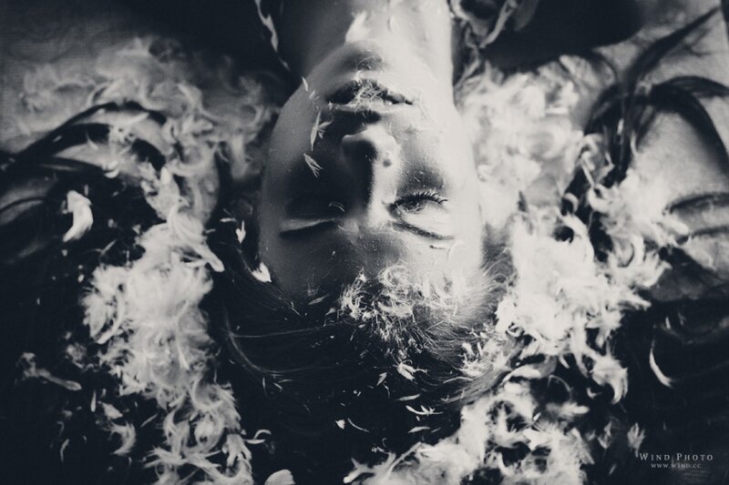 Woman Lying in Feathers — Black, Dreamy