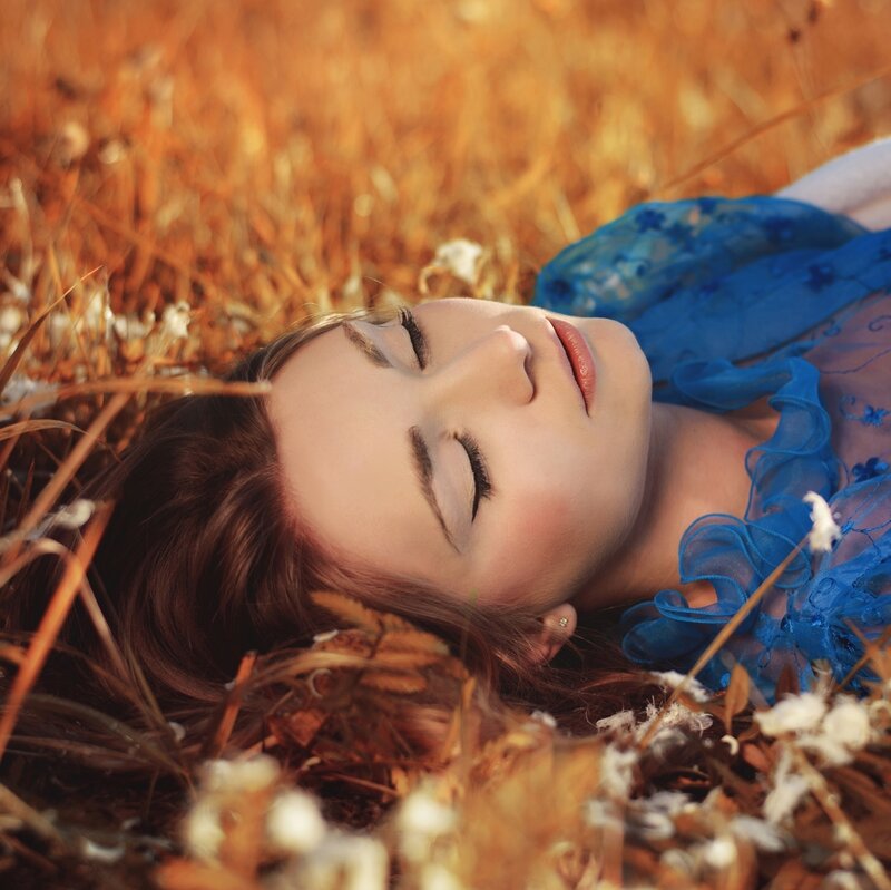 Woman Lying in Field — Blue, Serene