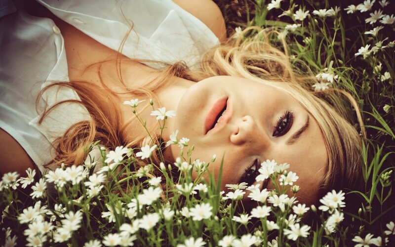 woman lying in flowers