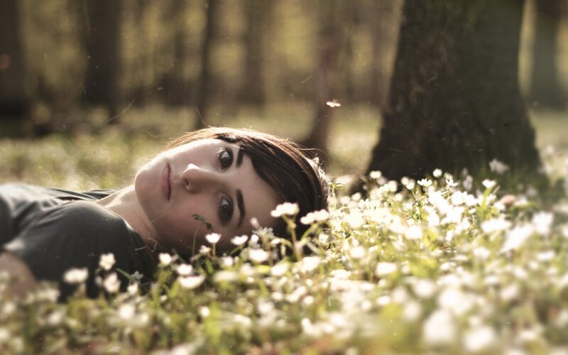 woman lying in flowers