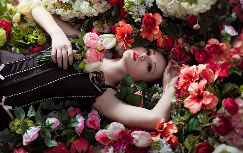 Woman Lying in Flowers — Black, Dramatic, Photograph