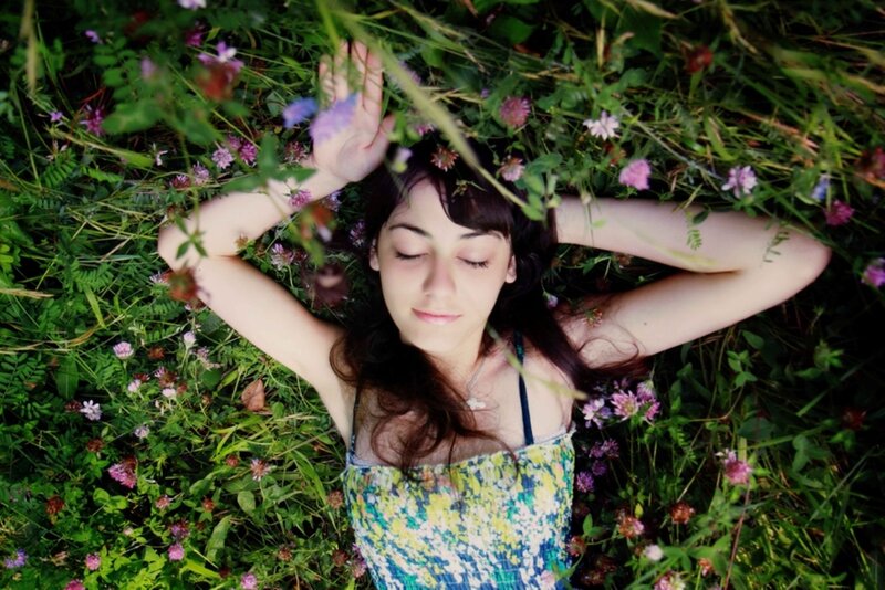 Woman Lying in Flowers — Green, Serene