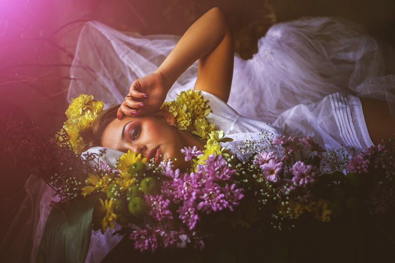 Woman Lying in Flowers — Purple, Dramatic, Photograph