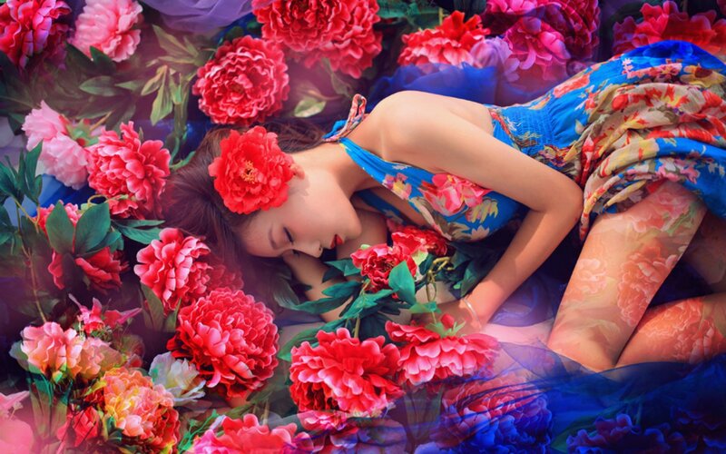 Woman Lying in Flowers — Red, Dreamy