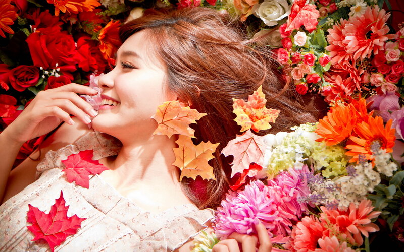 Woman Lying in Flowers — Red, Serene