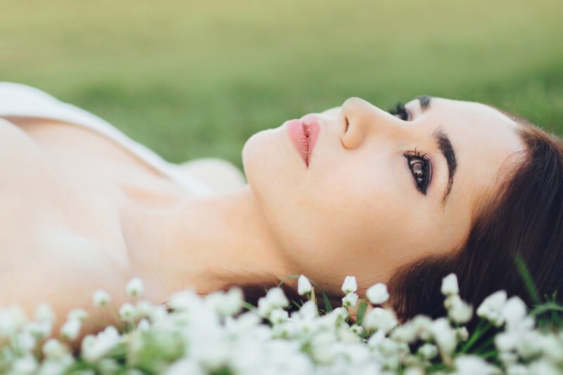 Woman Lying in Flowers — White, Serene, Afternoon, Photograph