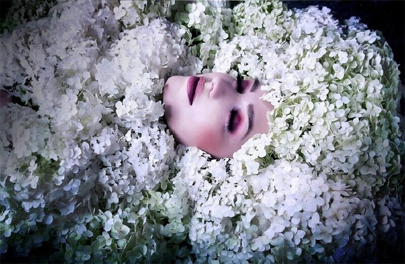 Woman Lying in Flowers — White, Serene, Photograph, Makeup
