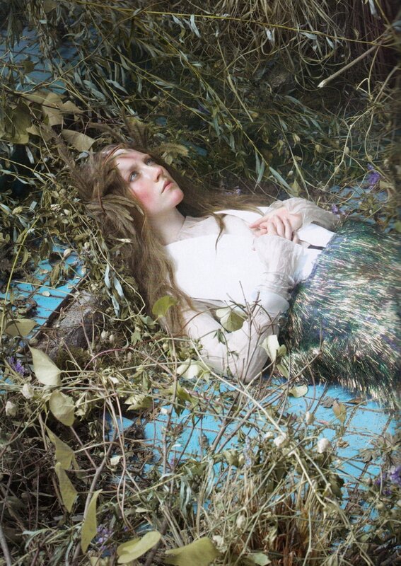 woman lying in foliage