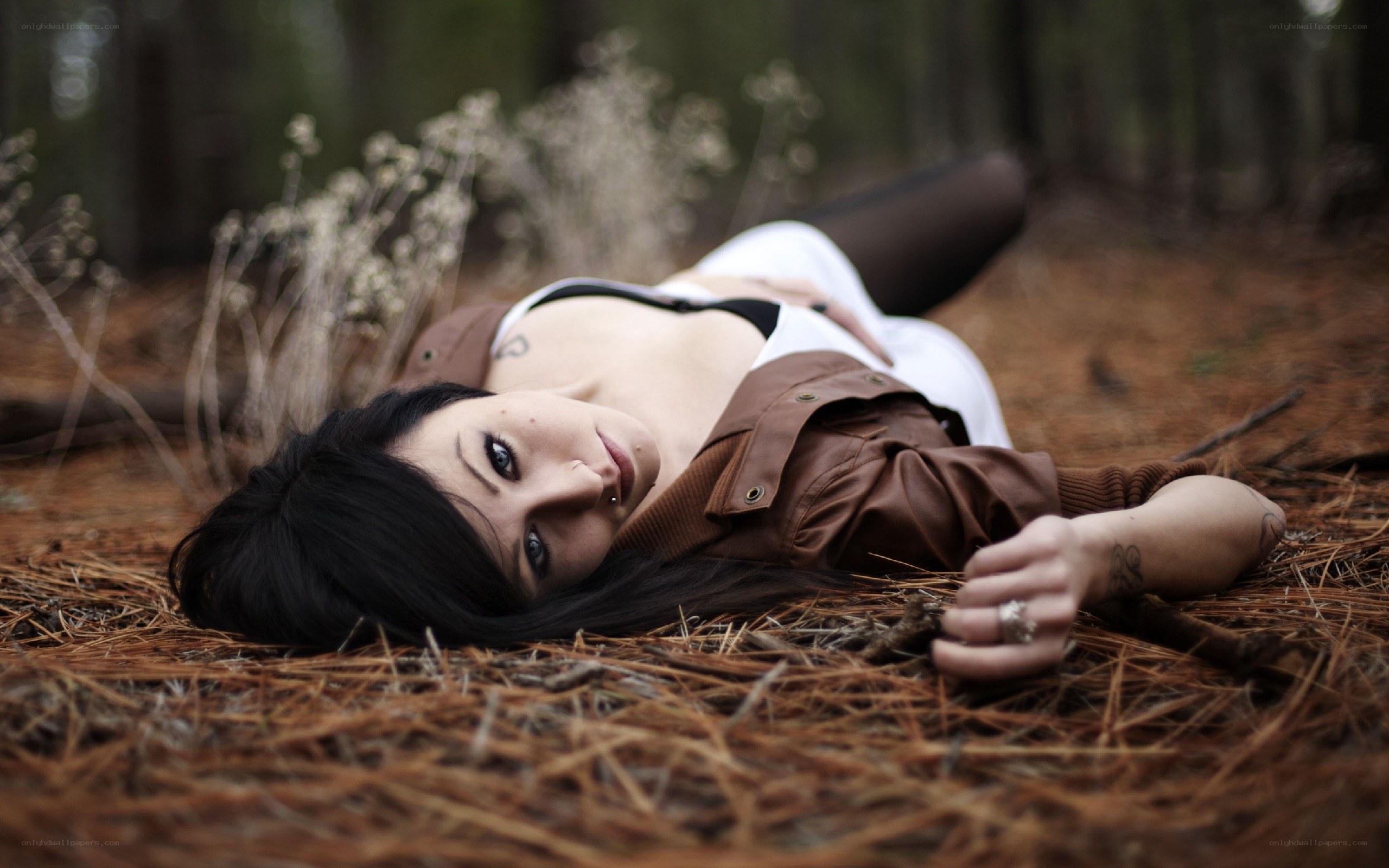 woman lying in forest