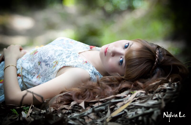 woman lying in forest