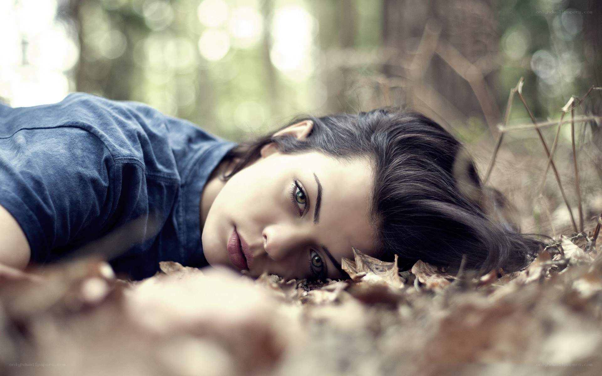 woman lying in forest