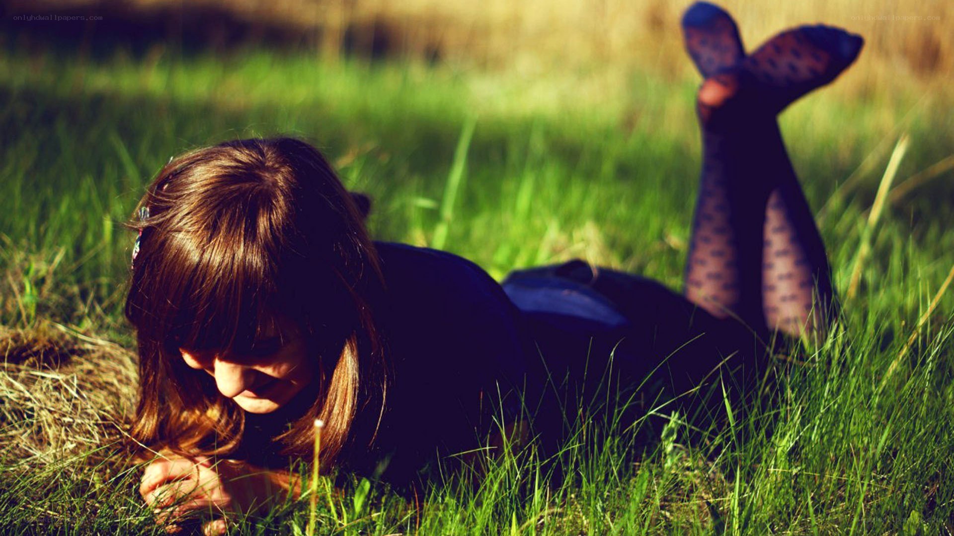 woman lying in grass