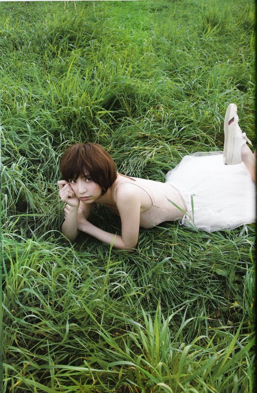 woman lying in grass
